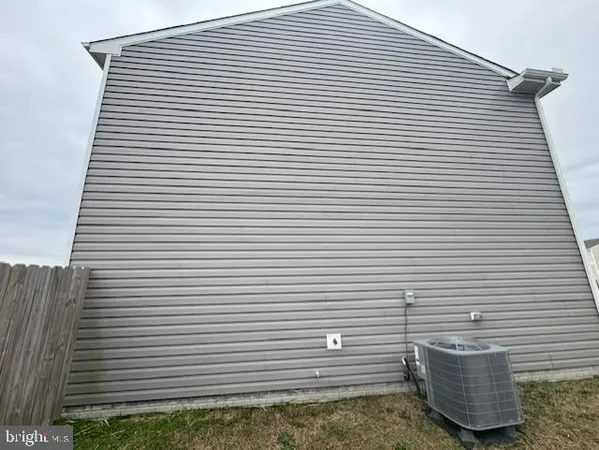 a view of a kitchen with a sink and a refrigerator