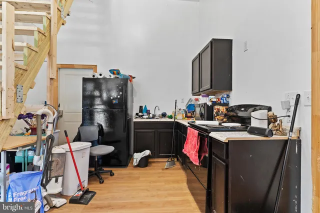 a room with furniture a rug and a fireplace