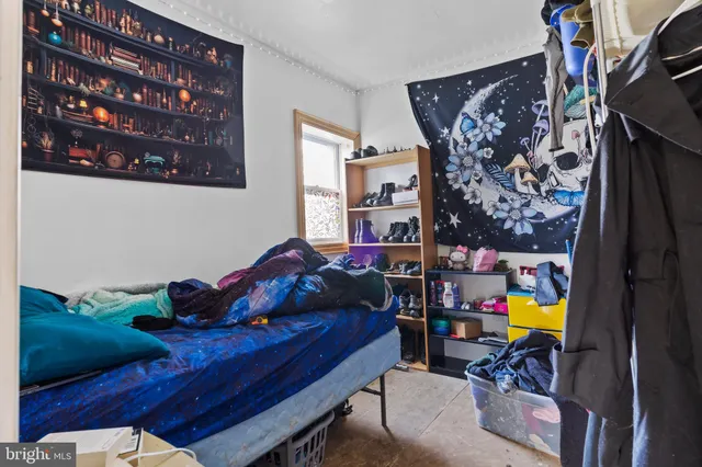 a bathroom with a granite countertop bathtub sink vanity mirror and toilet