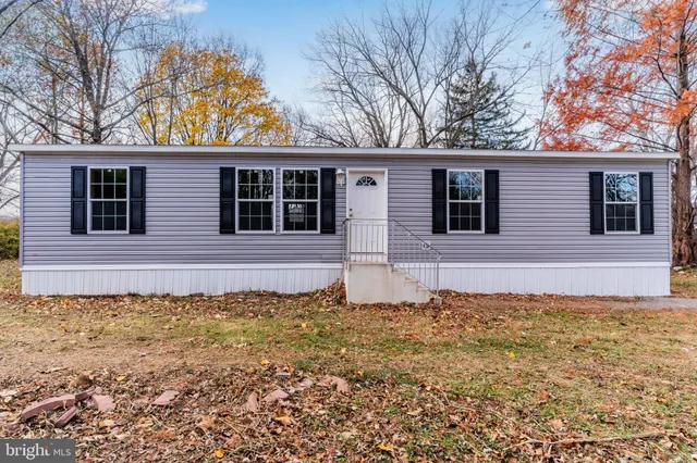 a house with trees in the background