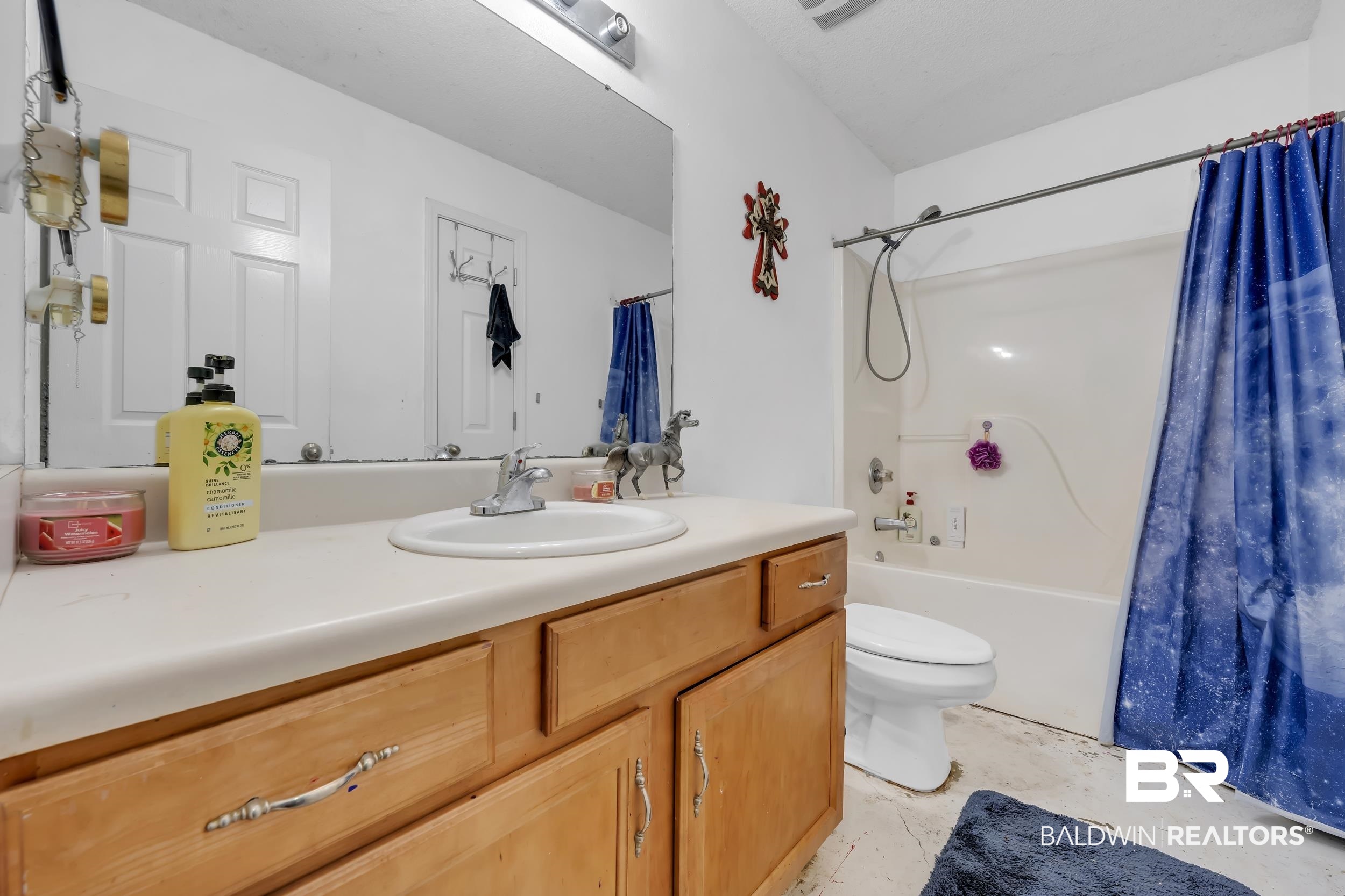 16603 Vanilla Drive Foley, AL 36535 - Photo 13 of 19 Bathroom featuring shower / tub combo with curtain and vanity