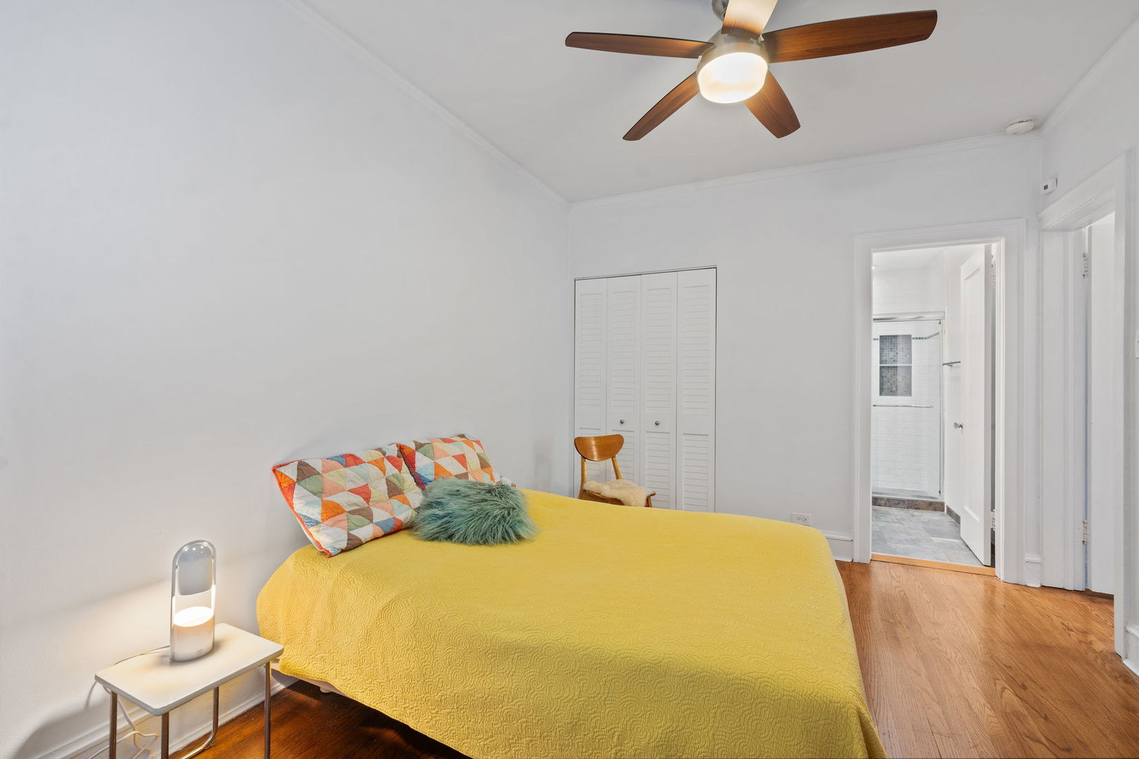 548 Sheridan Road, Unit 2N Evanston, IL 60202 - Photo 12 of 18 a bedroom with a bed and a chandelier