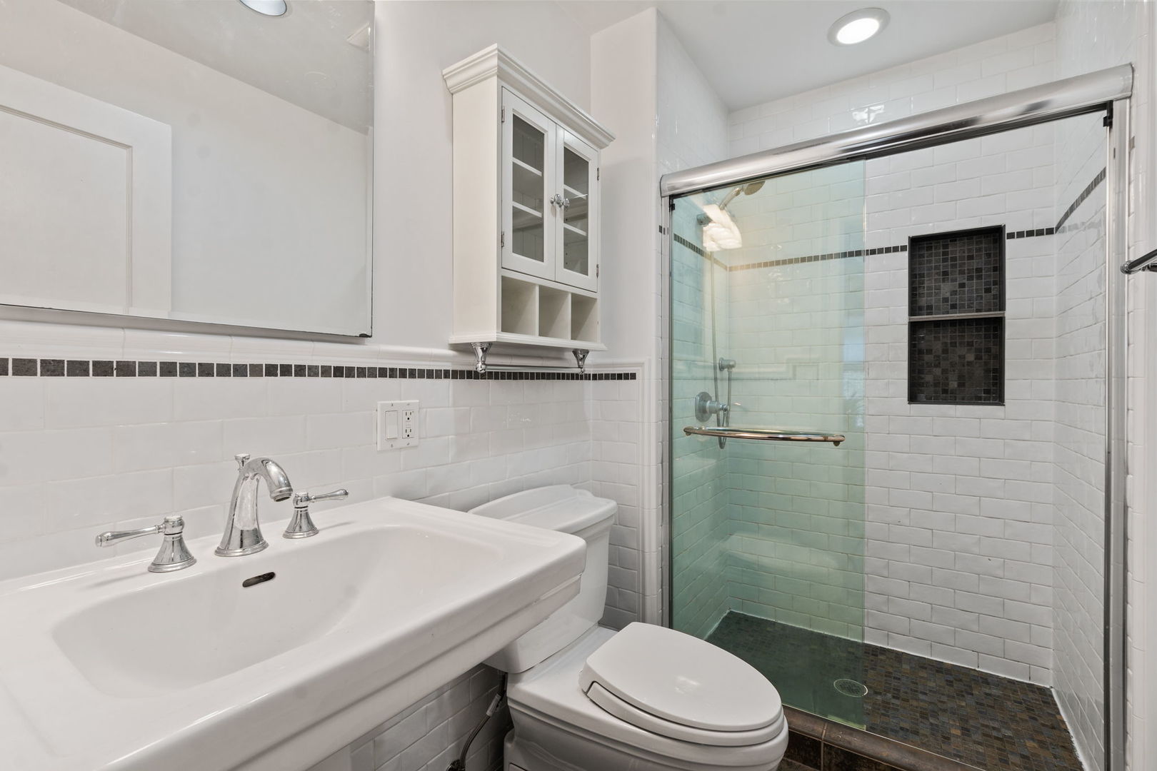 548 Sheridan Road, Unit 2N Evanston, IL 60202 - Photo 13 of 18 a bathroom with a sink a toilet and shower