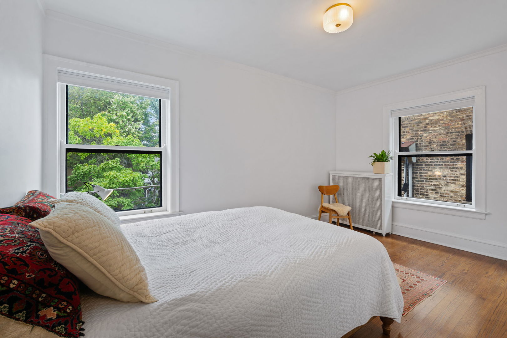548 Sheridan Road, Unit 2N Evanston, IL 60202 - Photo 16 of 18 a bed sitting in a bedroom next to a window