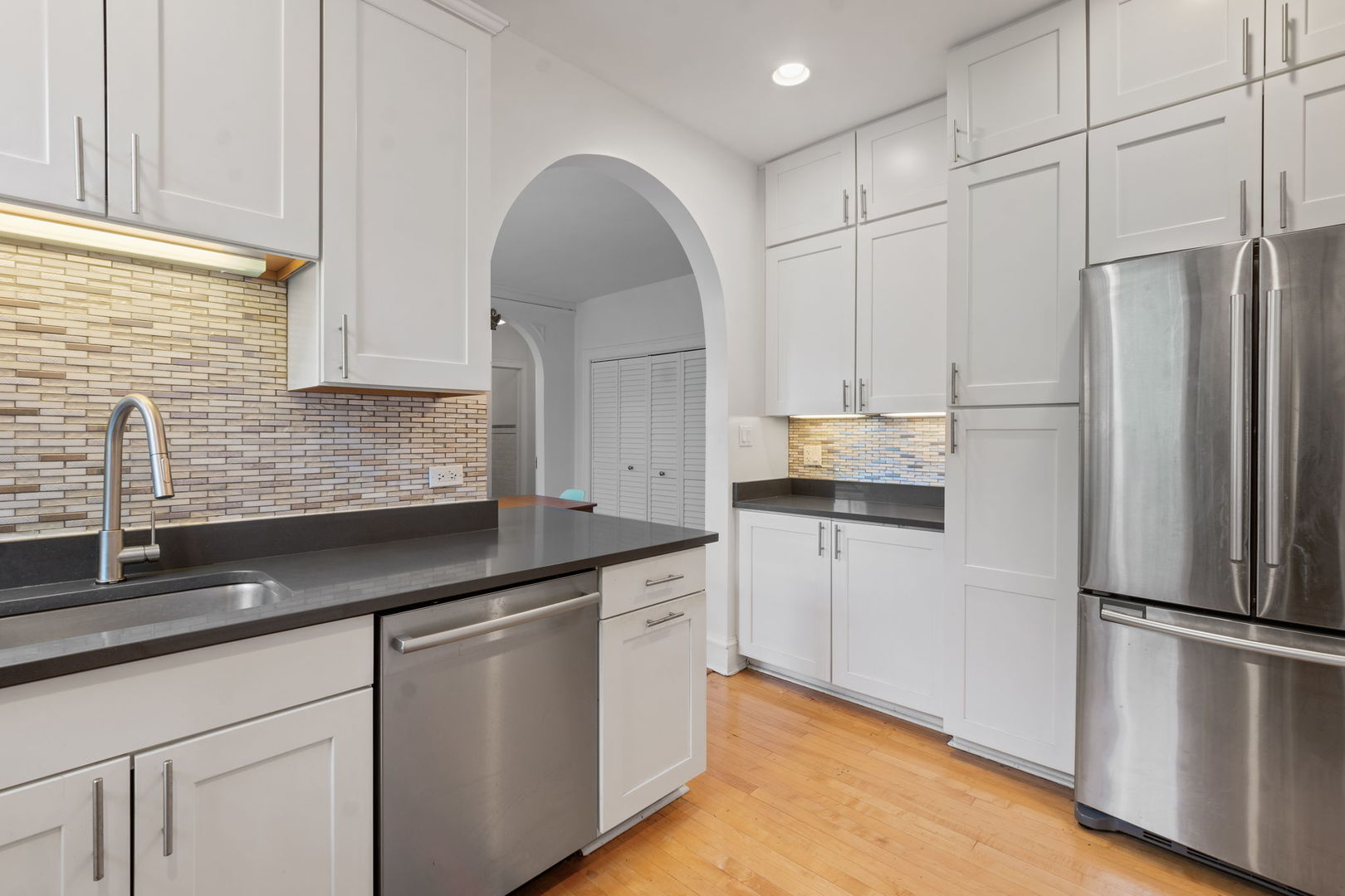 548 Sheridan Road, Unit 2N Evanston, IL 60202 - Photo 9 of 18 a kitchen with stainless steel appliances a refrigerator sink and cabinets