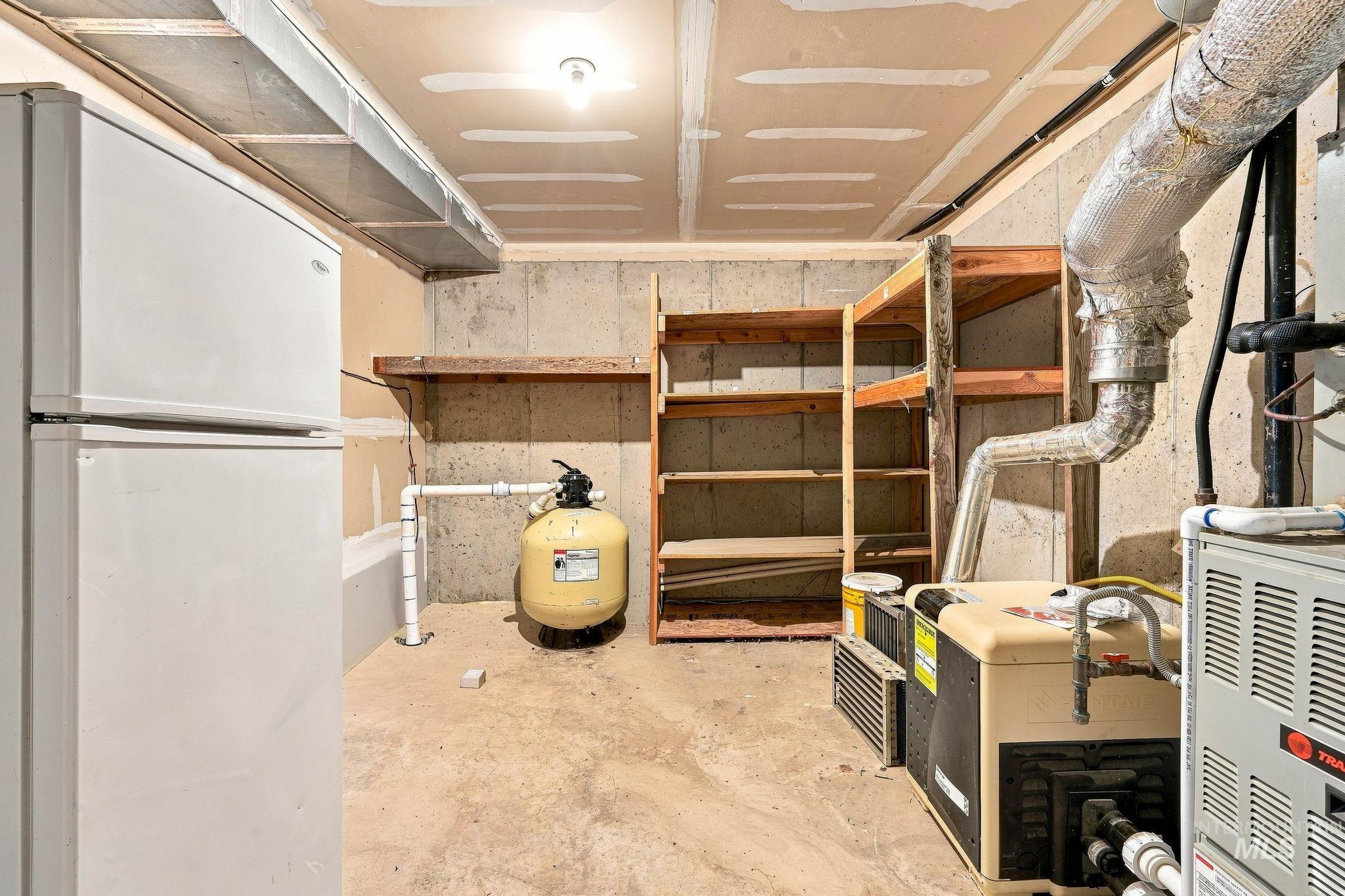 2442 West Hill Road Boise, ID 83702 - Photo 47 of 48 Utility area featuring a pool equipment and mechanical systems, built-in shelving, and exposed ceiling ductwork