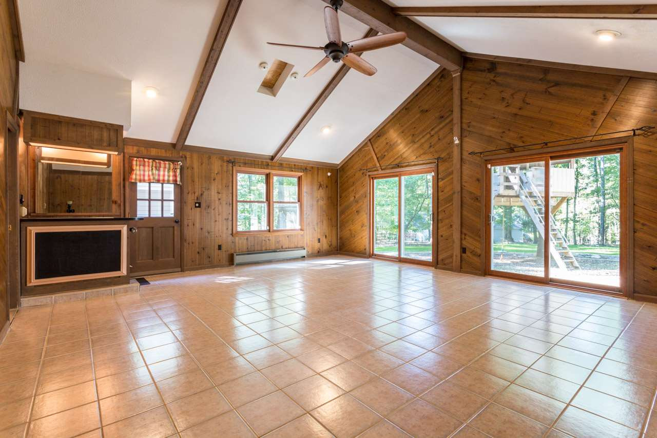 10205 Bushveld Lane Raleigh, NC 27613 - Photo 11 of 22 Large additional entertaining space with wet bar and tile floor Bonus Room