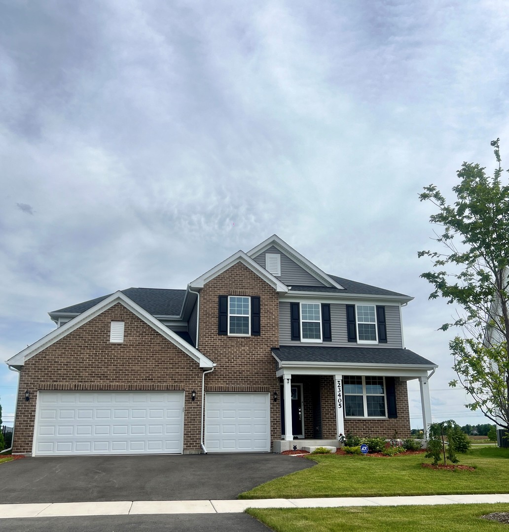 12766 Corbett Court Lemont, IL 60439 - Photo 1 of 1 a front view of a house with a yard and garage