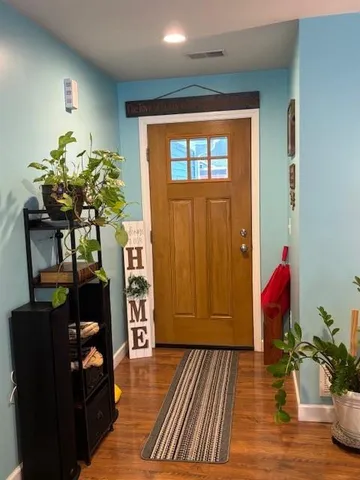 a living room with furniture and flowers
