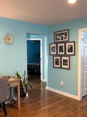 a view of a livingroom with furniture and workspace