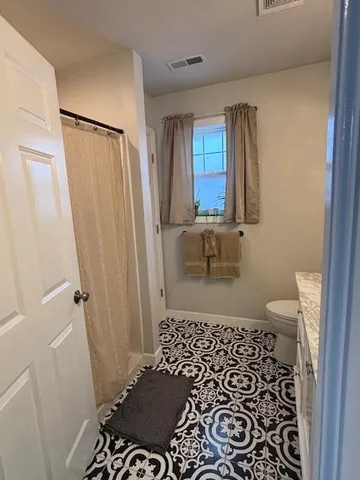 a bathroom with a sink and a shower