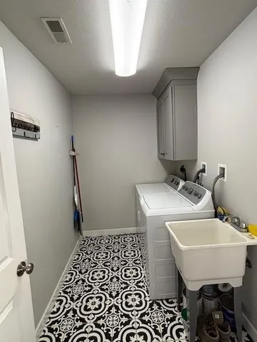 a bathroom with a sink toilet and a mirror
