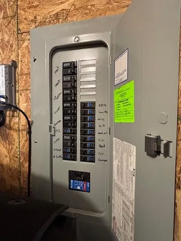 a front view of a house with a blue gate