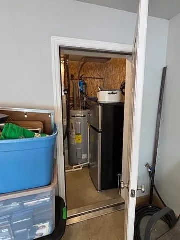 a kitchen with stainless steel appliances granite countertop a refrigerator and a stove