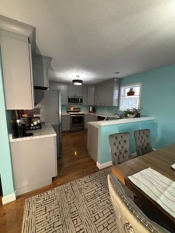 a living room with a couch and a counter top space