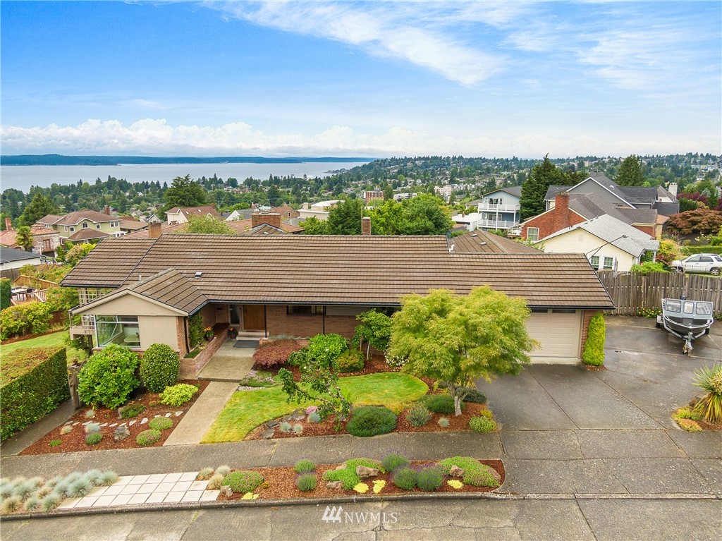 3904 Southwest Frontenac Street Seattle, WA 98136 - Photo 3 of 38 an aerial view of a house with a yard and lake view