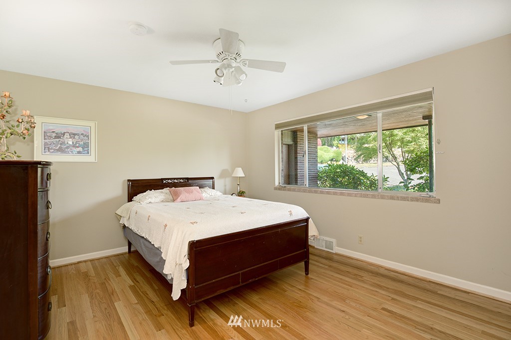 3904 Southwest Frontenac Street Seattle, WA 98136 - Photo 22 of 38 a bed sitting in a bedroom next to a window