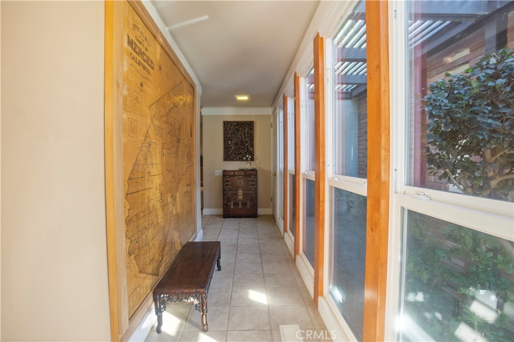 2858 Forist Lane Merced, CA 95340 - Photo 13 of 57 a view of a hallway with wooden floor and a bathroom