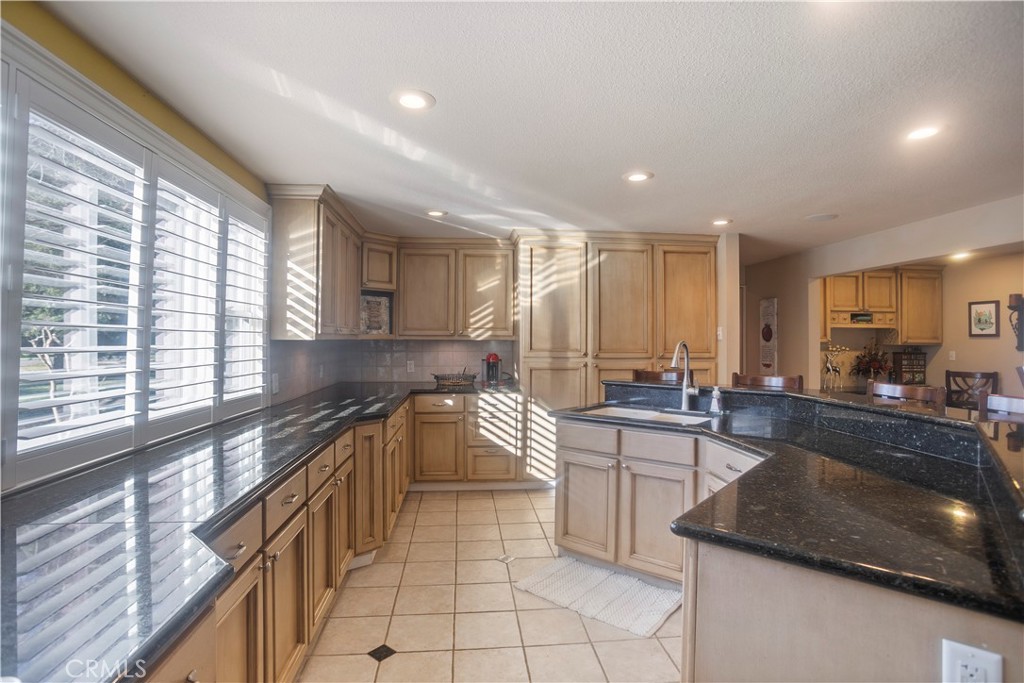 2858 Forist Lane Merced, CA 95340 - Photo 23 of 57 a kitchen with stainless steel appliances granite countertop a sink stove and cabinets