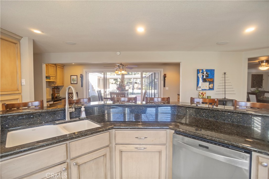 2858 Forist Lane Merced, CA 95340 - Photo 24 of 57 a kitchen with granite countertop white cabinets and white appliances
