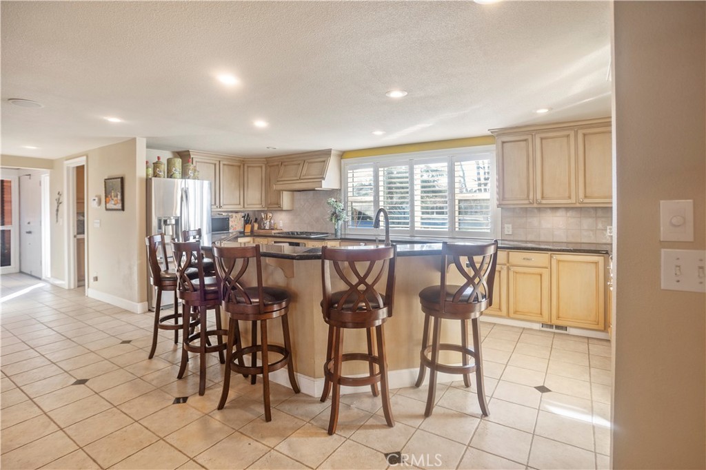 2858 Forist Lane Merced, CA 95340 - Photo 27 of 57 a dining area with granite countertop a table and chairs