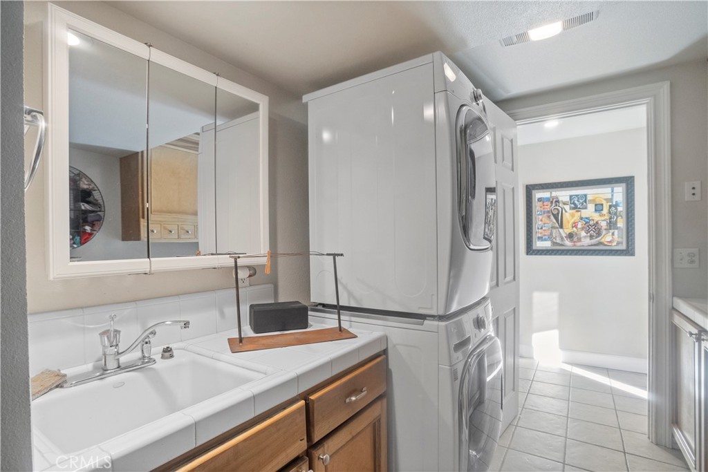 2858 Forist Lane Merced, CA 95340 - Photo 30 of 57 a bathroom with a sink mirror and a shower
