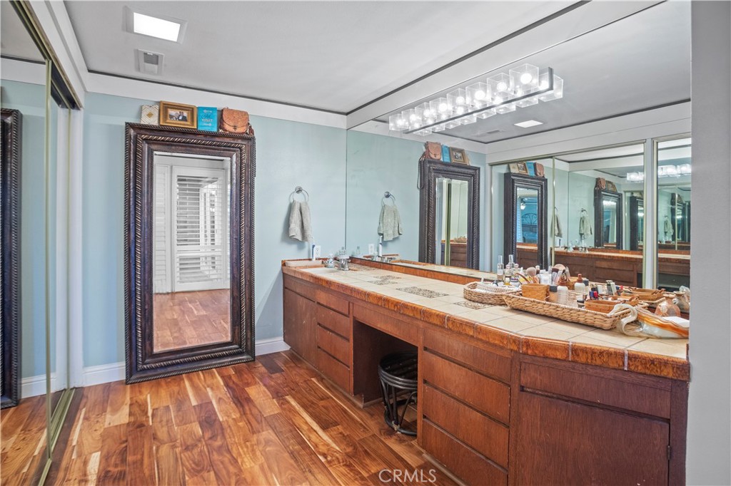 2858 Forist Lane Merced, CA 95340 - Photo 35 of 57 a bathroom with a sink a large mirror and vanity
