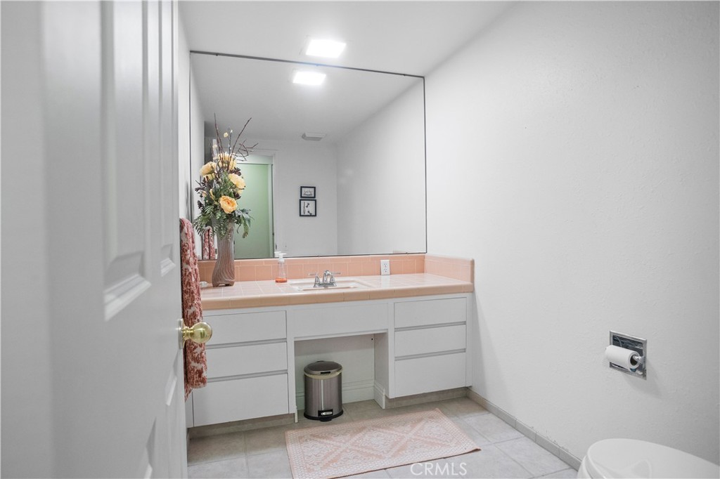 2858 Forist Lane Merced, CA 95340 - Photo 39 of 57 a bathroom with a sink and a mirror