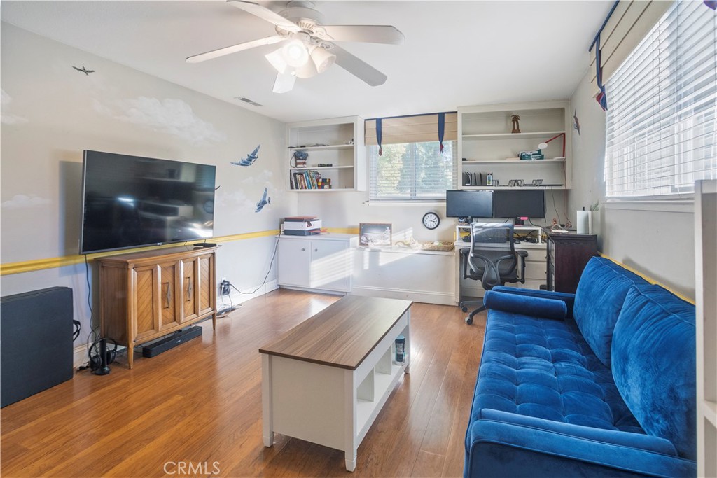 2858 Forist Lane Merced, CA 95340 - Photo 43 of 57 a living room with furniture wooden floor and a flat screen tv