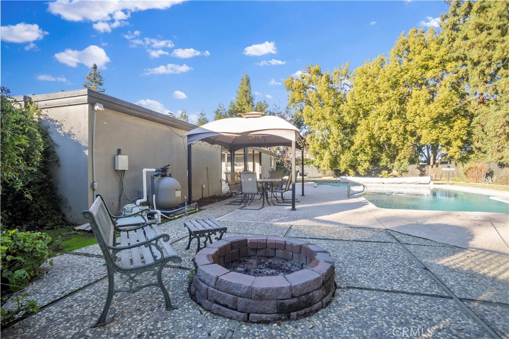 2858 Forist Lane Merced, CA 95340 - Photo 44 of 57 a view of a patio with a table and chairs and potted plants