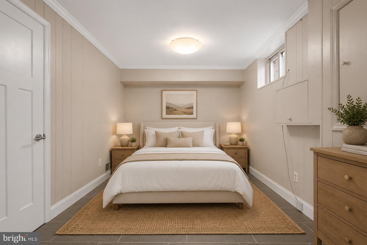 822 Loxford Terrace Silver Spring, MD 20901 - Photo 46 of 61 a bedroom with a bed and a potted plant