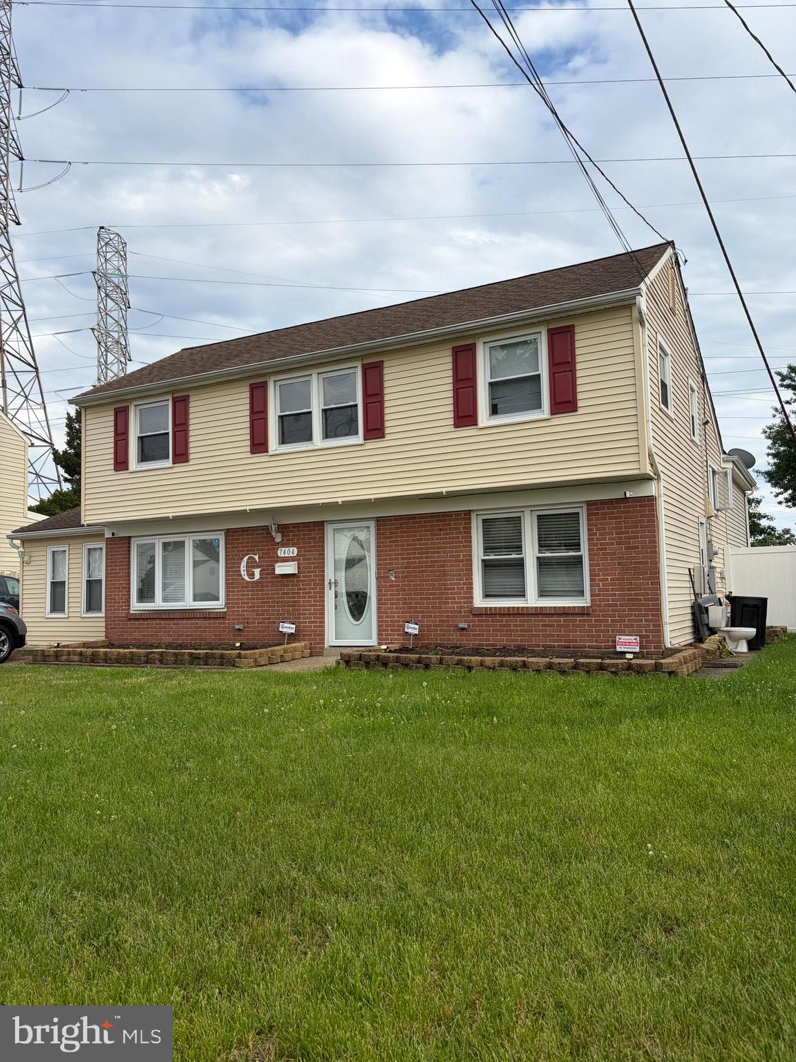7404 Wyndam Road Pennsauken, NJ 08110 - Photo 2 of 50 a front view of a house with a garden