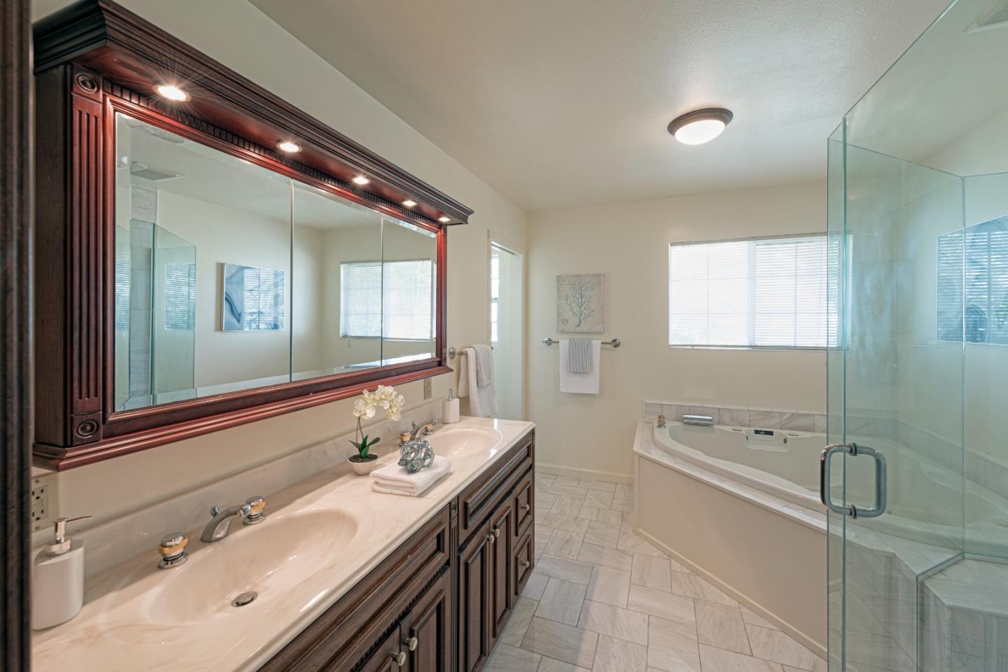 1623 Corte Via Los Altos, CA 94024 - Photo 13 of 25 a spacious bathroom with a double vanity sink a mirror and a bathtub
