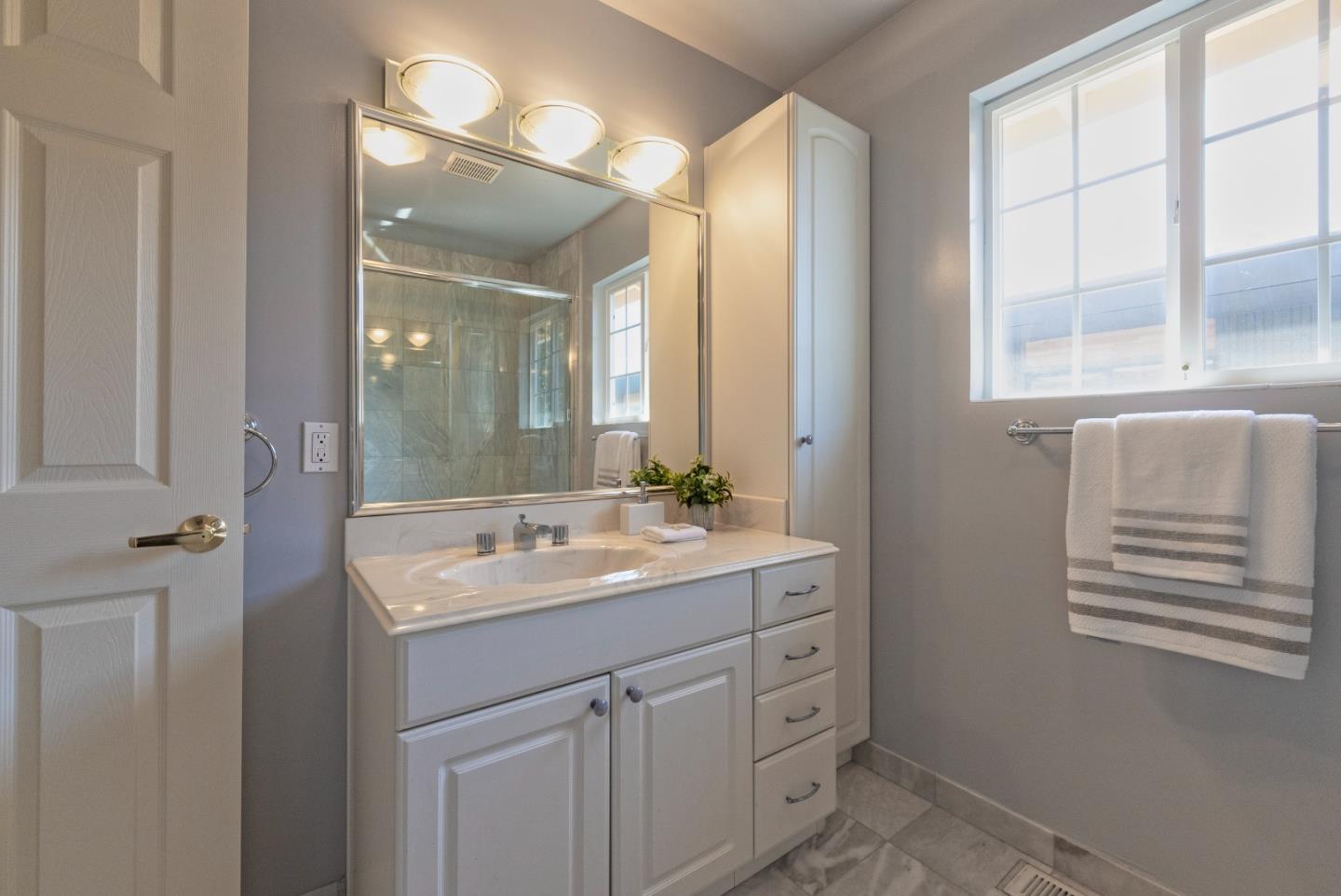 1623 Corte Via Los Altos, CA 94024 - Photo 16 of 25 a bathroom with a sink a vanity and a mirror