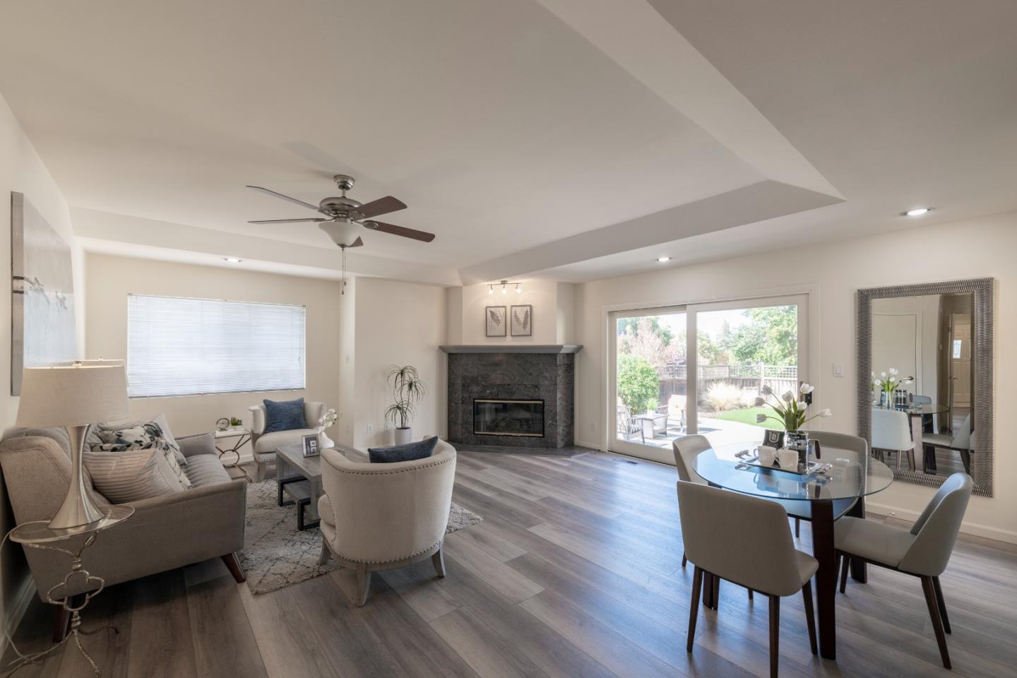 1623 Corte Via Los Altos, CA 94024 - Photo 4 of 25 a living room with furniture a fireplace and a chandelier