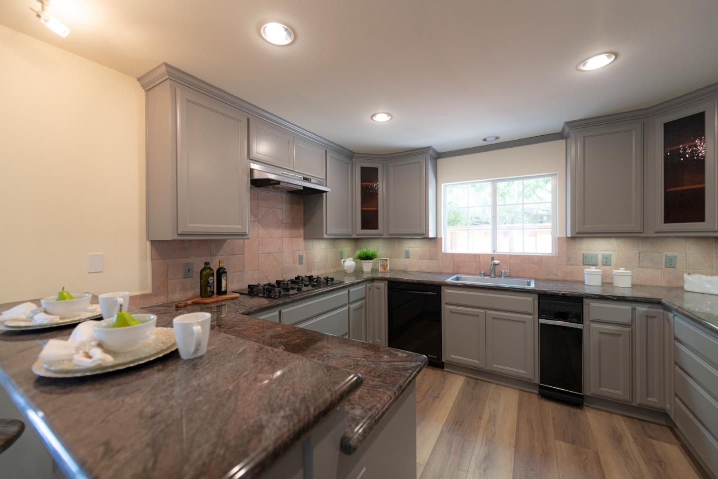 1623 Corte Via Los Altos, CA 94024 - Photo 7 of 25 a kitchen with stainless steel appliances granite countertop sink stove top oven and cabinets