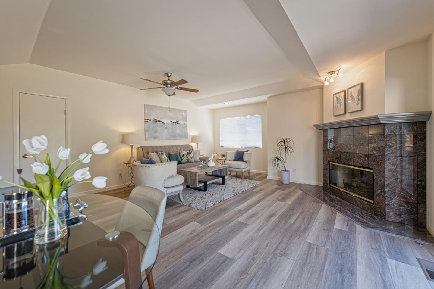 1623 Corte Via Los Altos, CA 94024 - Photo 8 of 25 a living room with furniture a fireplace and a potted plant