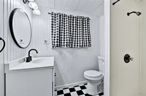 a bedroom with a bed window and a desk