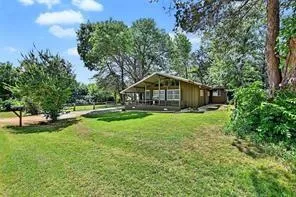 a house view with a backyard space