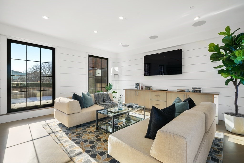 75 Beacon Street, Unit 2 Boston, MA 02108 - Photo 16 of 37 a living room with furniture and a flat screen tv