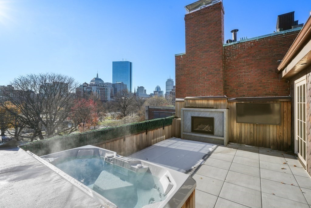 75 Beacon Street, Unit 2 Boston, MA 02108 - Photo 17 of 37 a view of a terrace with a fireplace