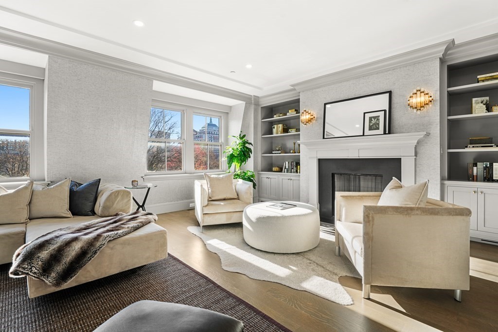 75 Beacon Street, Unit 2 Boston, MA 02108 - Photo 2 of 37 a living room with furniture and a fireplace