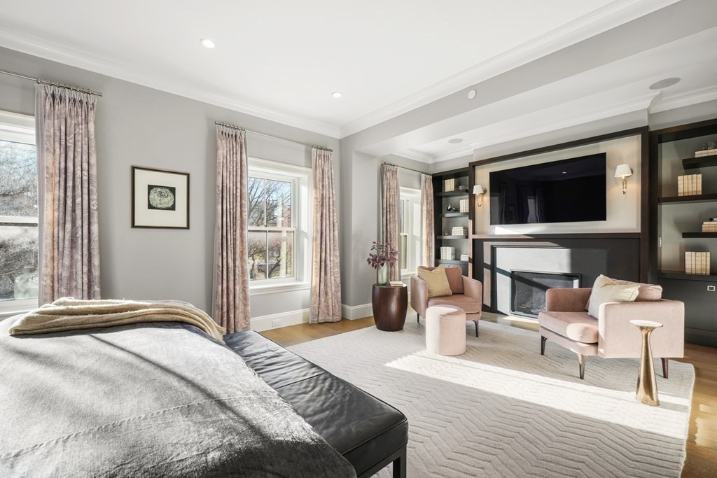 75 Beacon Street, Unit 2 Boston, MA 02108 - Photo 27 of 37 a bedroom with a balcony a bed and a flat screen tv