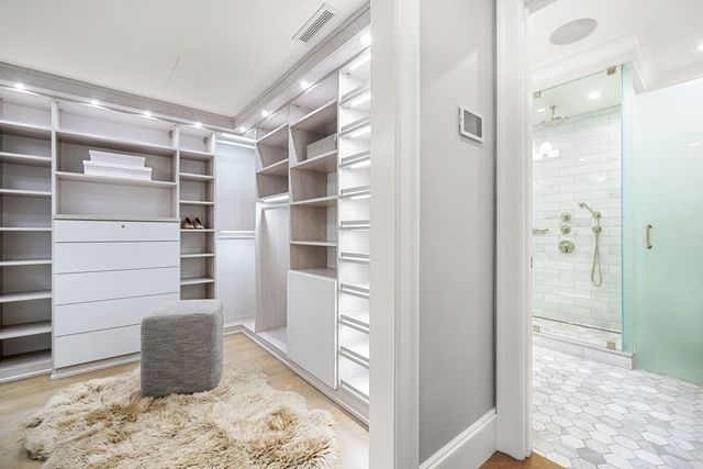a bathroom with a shower sink and mirror