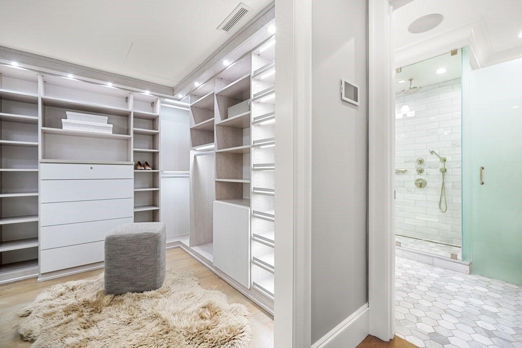 75 Beacon Street, Unit 2 Boston, MA 02108 - Photo 30 of 37 a room with walk in closet and wooden floor