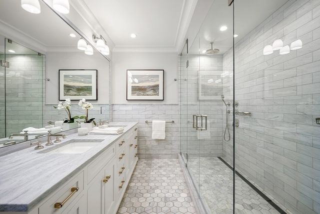 a bedroom with furniture and a flat screen tv