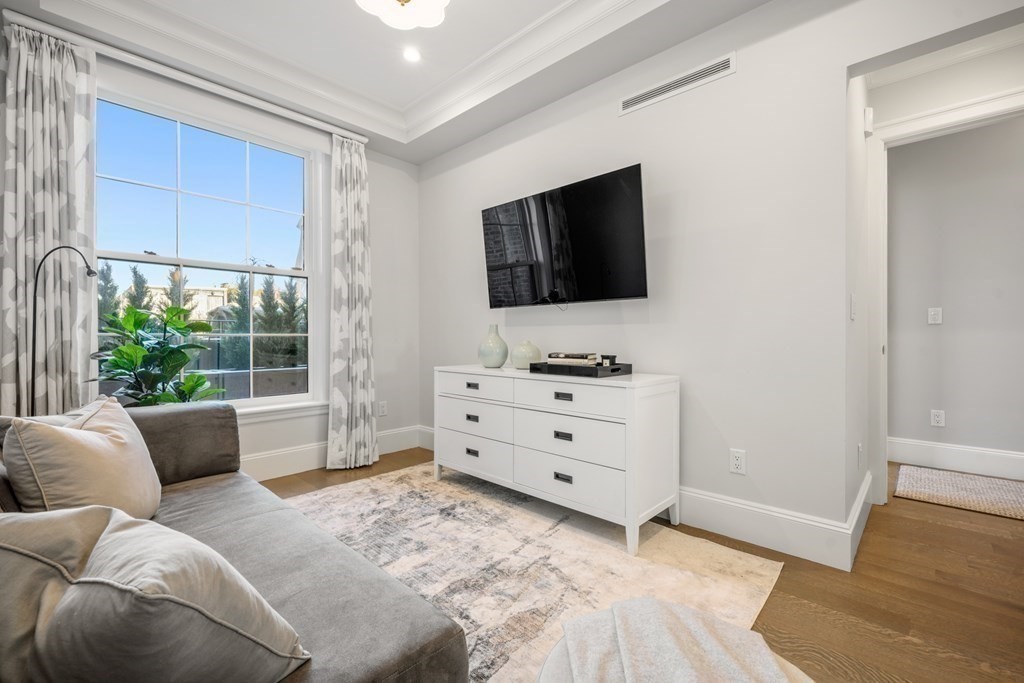 75 Beacon Street, Unit 2 Boston, MA 02108 - Photo 33 of 37 a bedroom with furniture and a flat screen tv