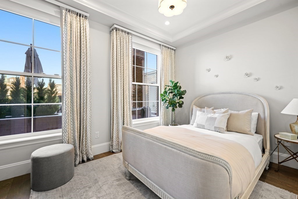 75 Beacon Street, Unit 2 Boston, MA 02108 - Photo 34 of 37 a bedroom with a large bed and a potted plant