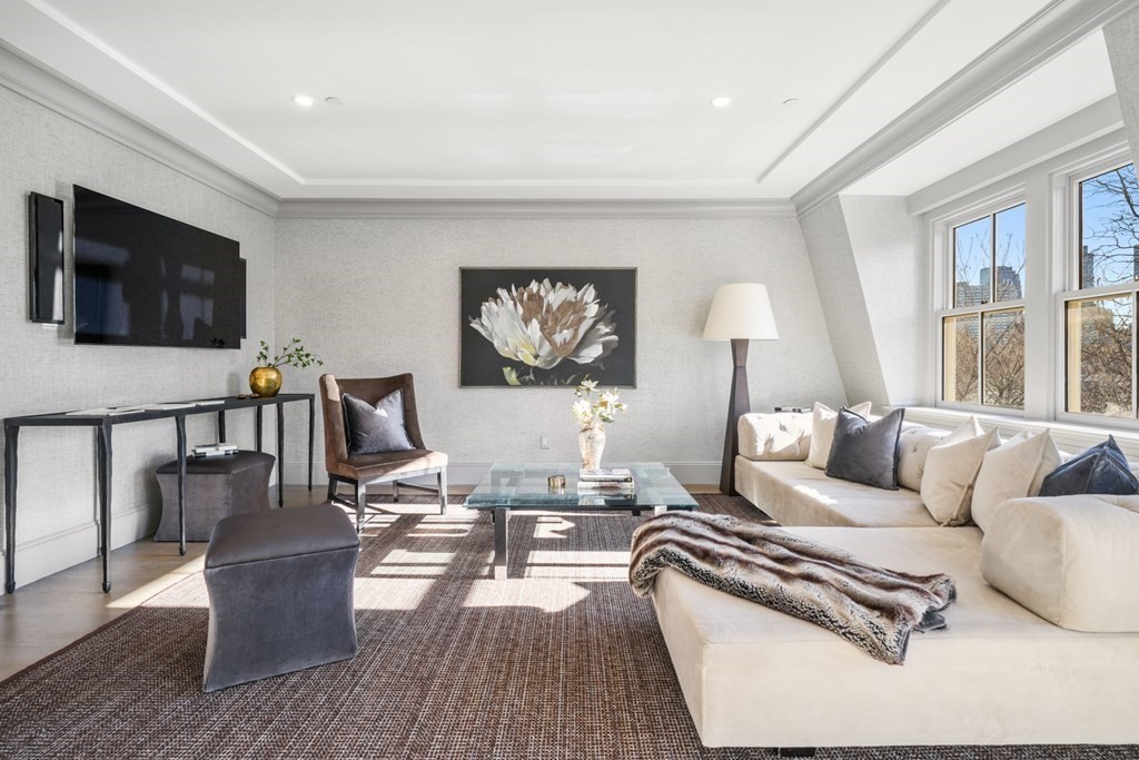 75 Beacon Street, Unit 2 Boston, MA 02108 - Photo 5 of 37 a living room with furniture fireplace and a flat screen tv