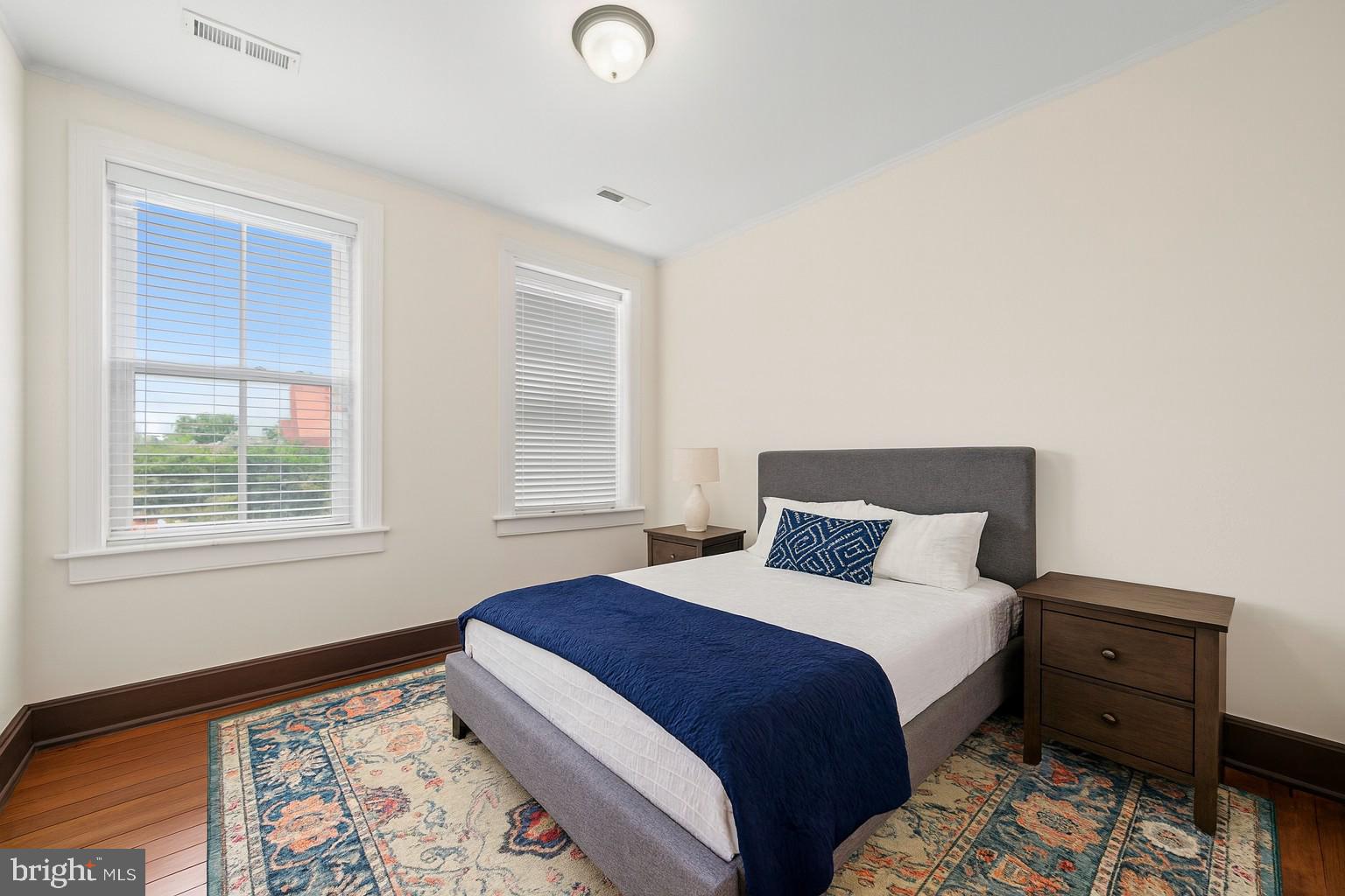 415 William Street, Unit A Fredericksburg, VA 22401 - Photo 13 of 17 a bedroom with a bed and a window